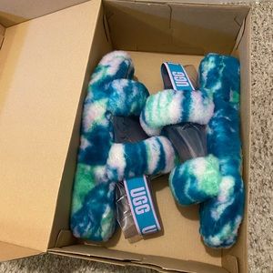 UGG women's sandals fluff blue with green size 9. New in the box.